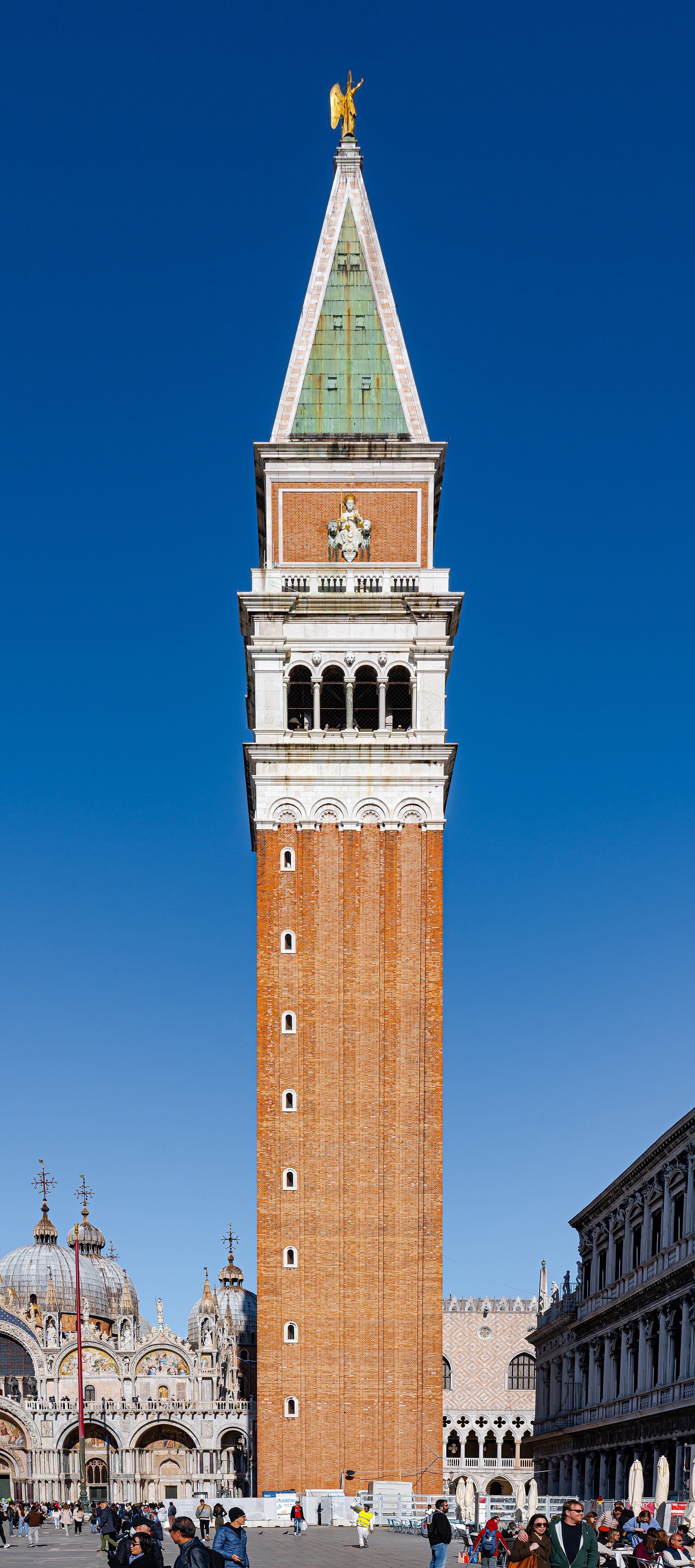 West face of St Mark's Campanile, a tall brick tower with a stone belfry
